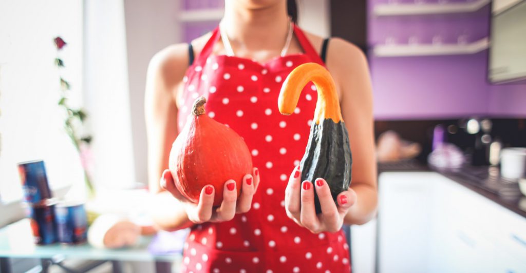 Woman with colorful pumpkins